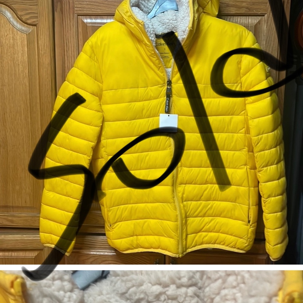 Beautiful woman’s Calvin Klein winter jacket